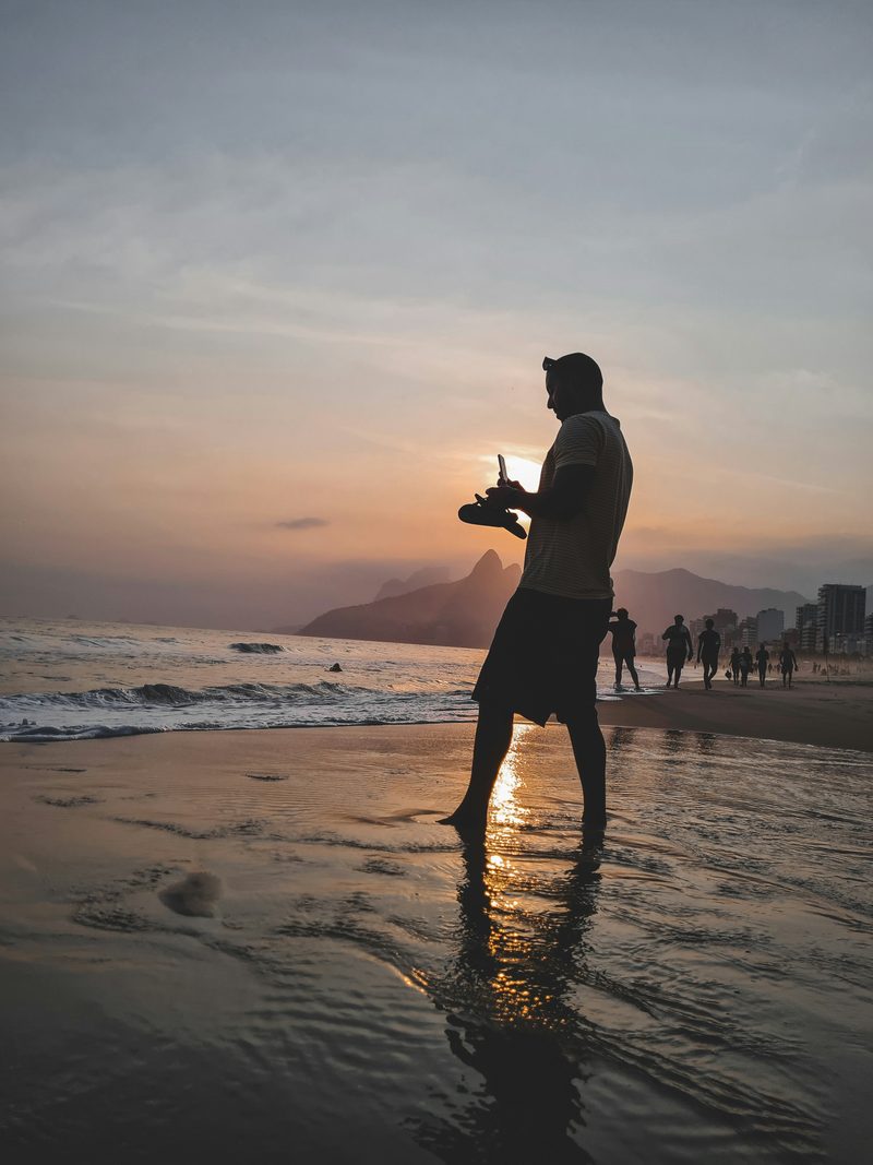 Person looking over a sunset landscape