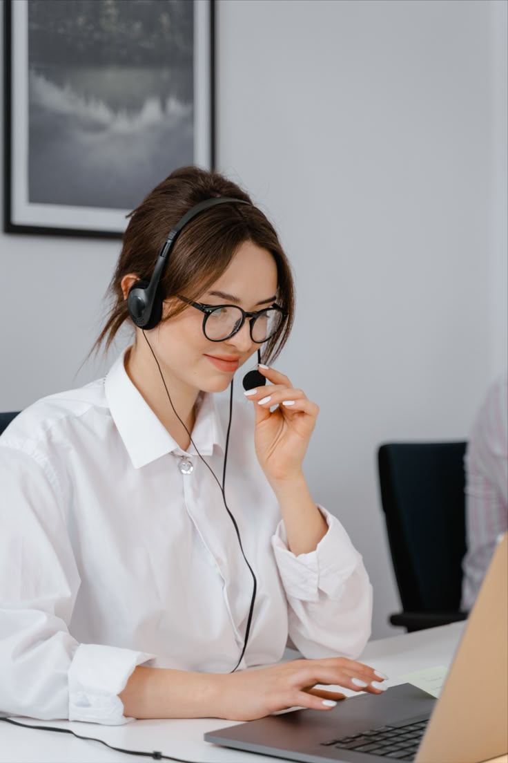 Support agent wearing a headset, ready to answer a call
